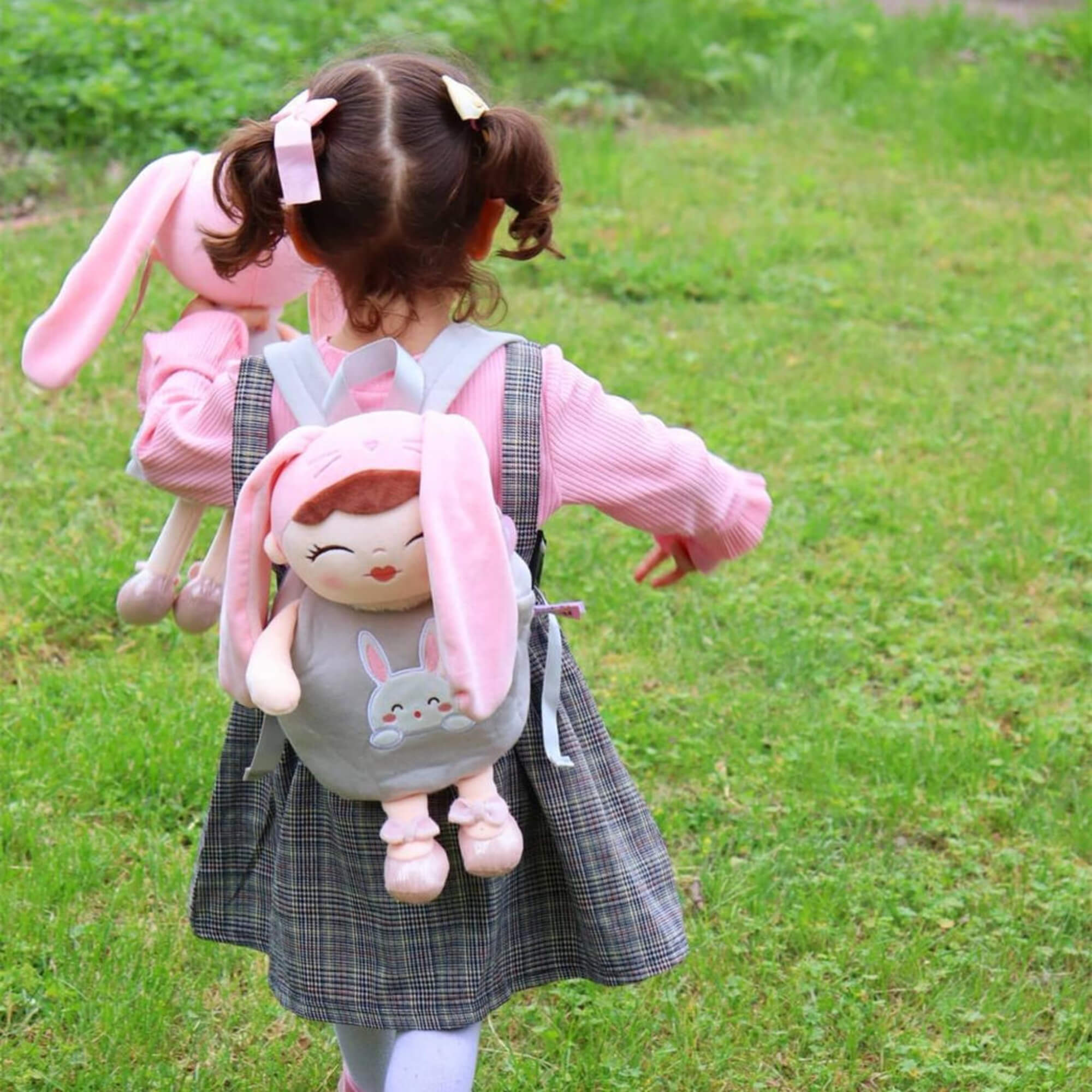 Child running outside with Dreambaby toddler super soft rabbit backpack
